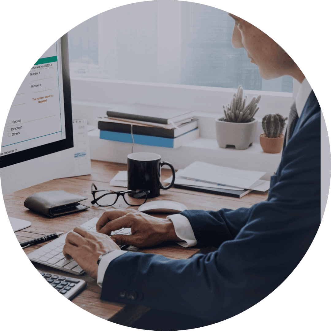 Professional working at desk with computer and office setup